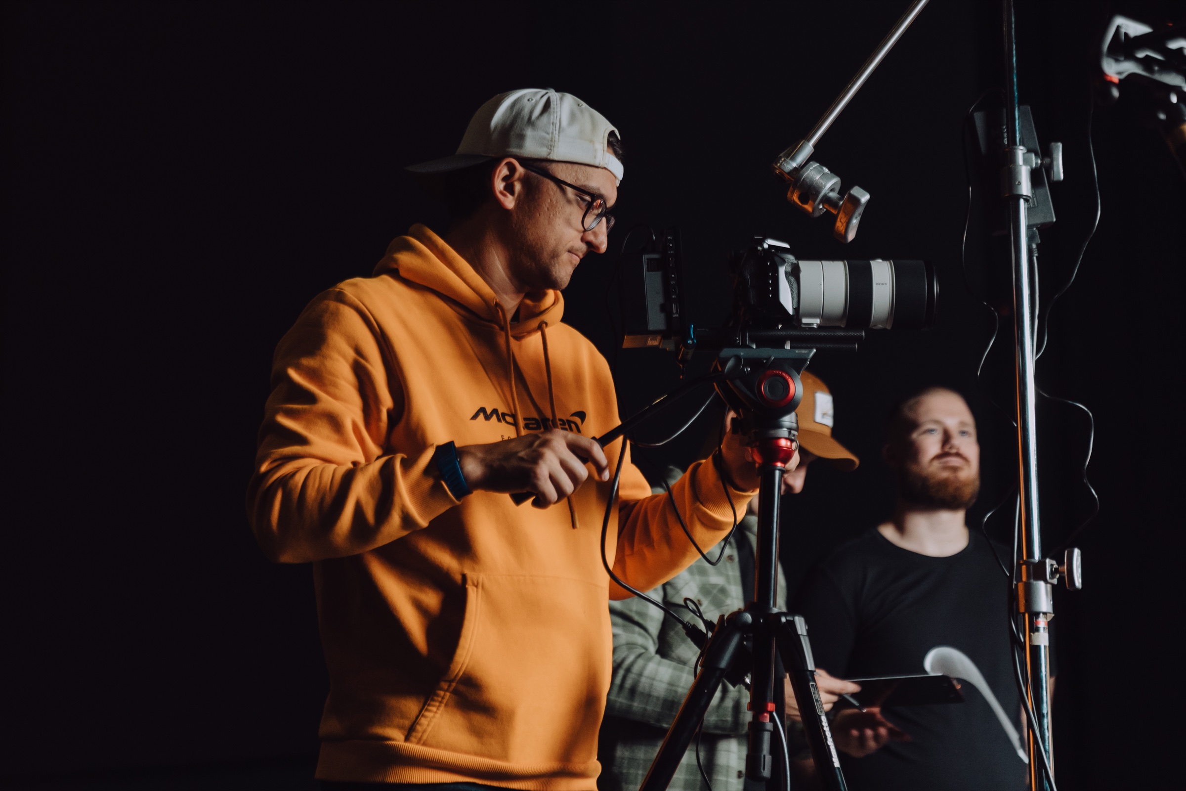 Tyler Herrinton operating a cinema camera on set